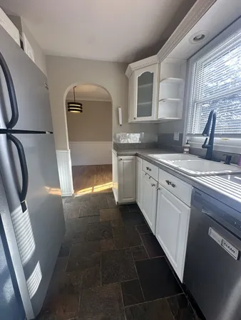 a kitchen with a sink and cabinets
