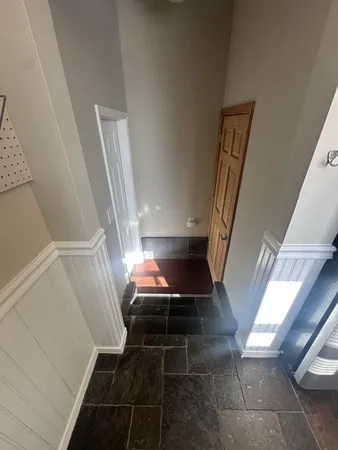 a view of entryway and kitchen