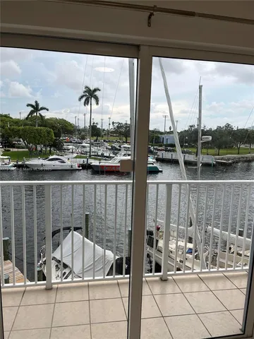 a view of swimming pool with outdoor seating and plants