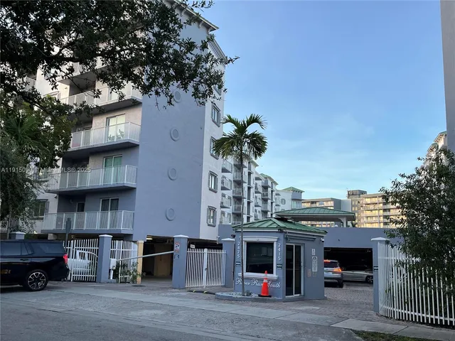 a view of a car park in front of a building