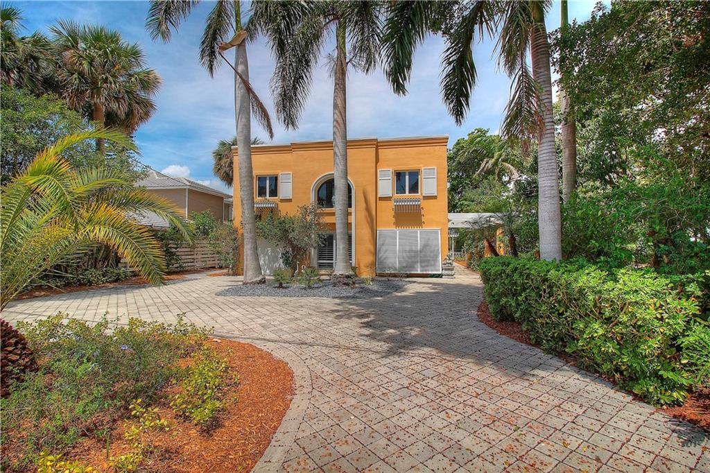 1509 Southeast Riverside Drive Stuart, FL 34996 - Photo 1 of 26 front view of a house with a yard