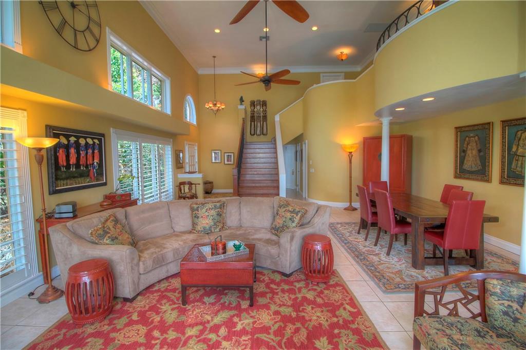 1509 Southeast Riverside Drive Stuart, FL 34996 - Photo 5 of 26 a living room with furniture and a chandelier