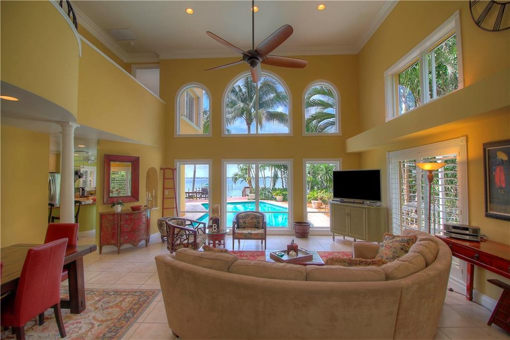 1509 Southeast Riverside Drive Stuart, FL 34996 - Photo 6 of 26 a living room with fireplace furniture and a large window