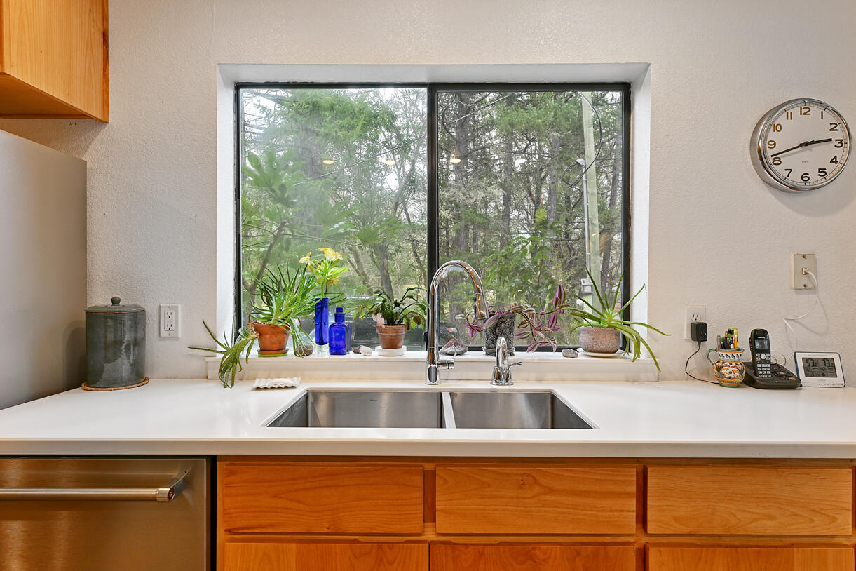 9355 Lower River Road Grants Pass, OR 97526 - Photo 10 of 41 a kitchen with a sink and a large window