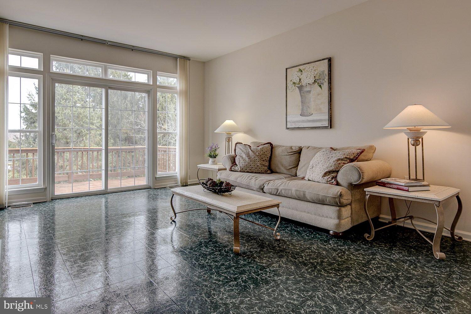 1447 Quaker Ridge West Chester, PA 19380 - Photo 8 of 25 FAMILY ROOM WITH SLIDERS TO DECK