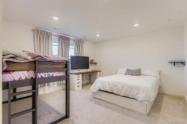 a bedroom with a bed and two night stand