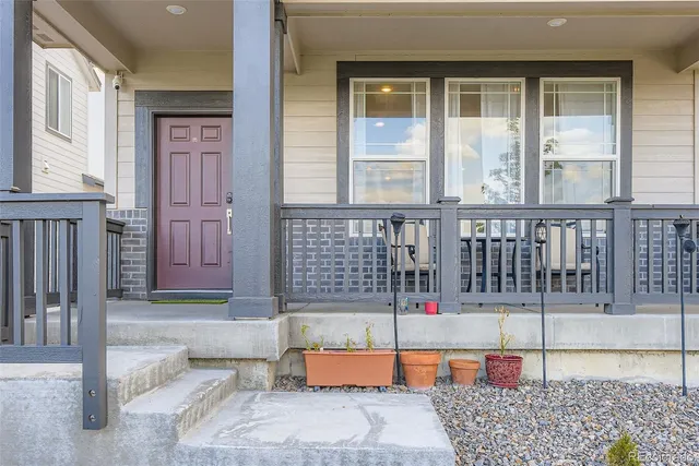 a balcony view with a glass door