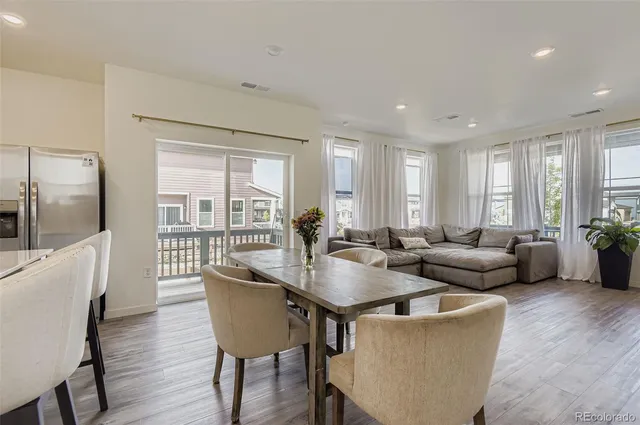 a living room with furniture and a table