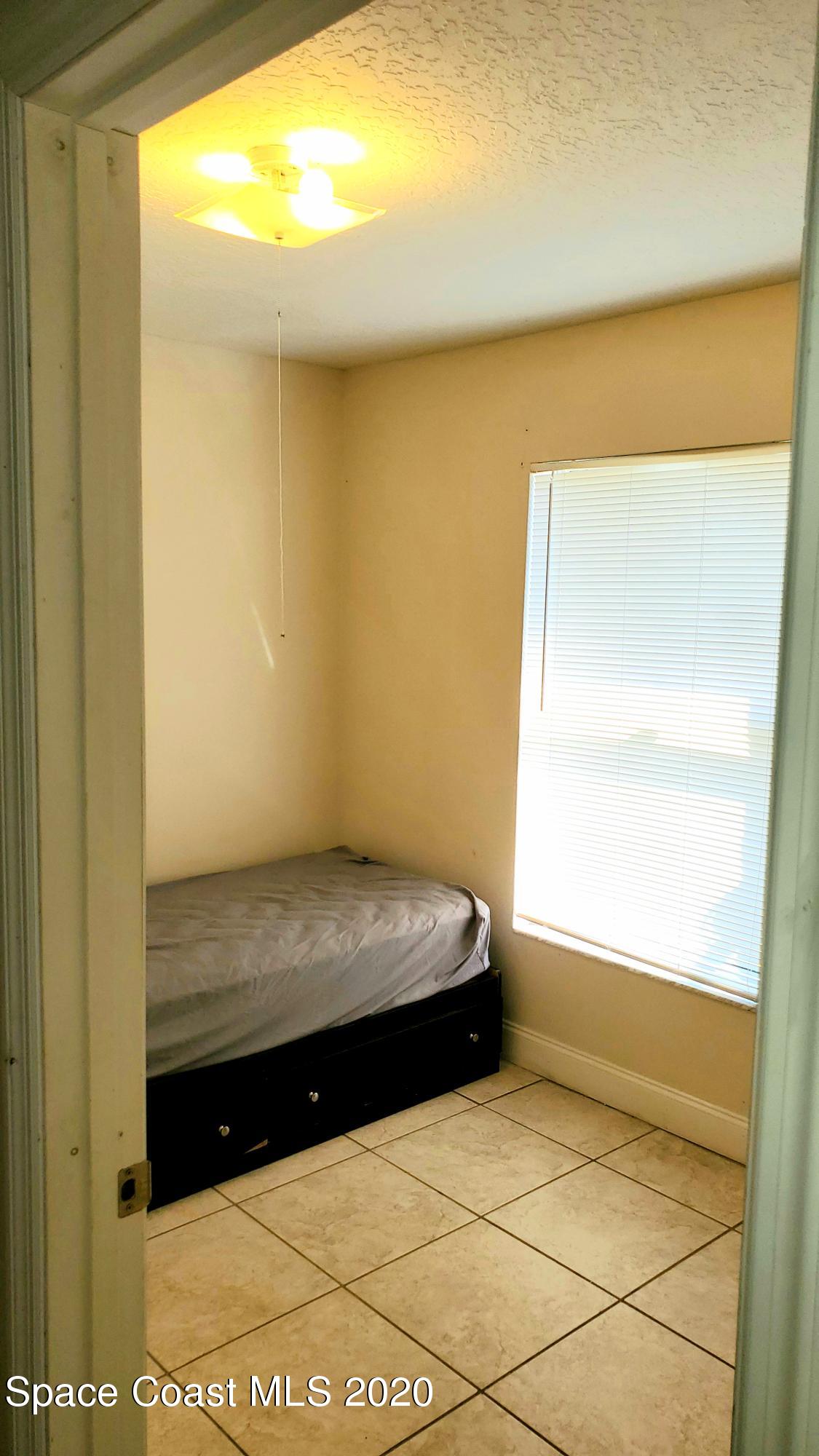 920 Grove Avenue Cocoa, FL 32922 - Photo 6 of 13 a view of an empty room and window