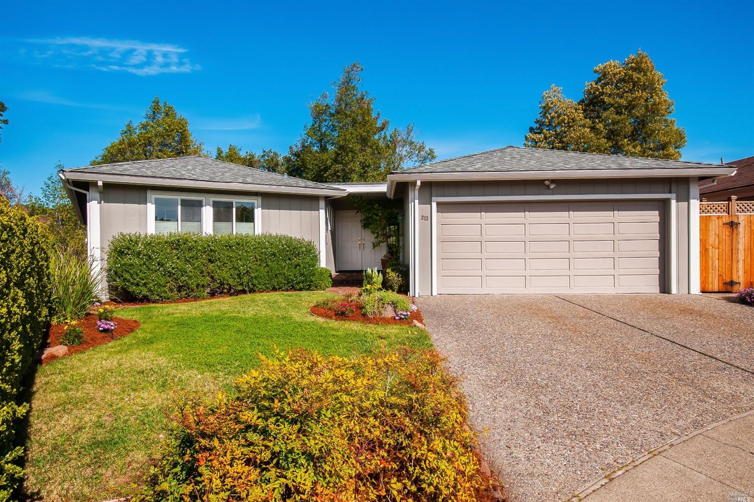 213 Reservoir Road San Rafael, CA 94901 - Photo 1 of 1 a front view of a house with a yard and garage