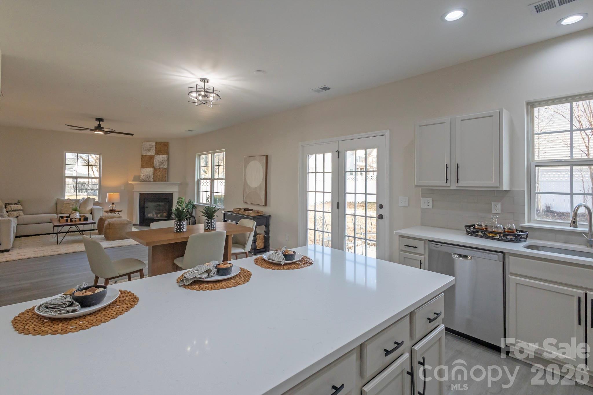 a kitchen with a sink stove and cabinets