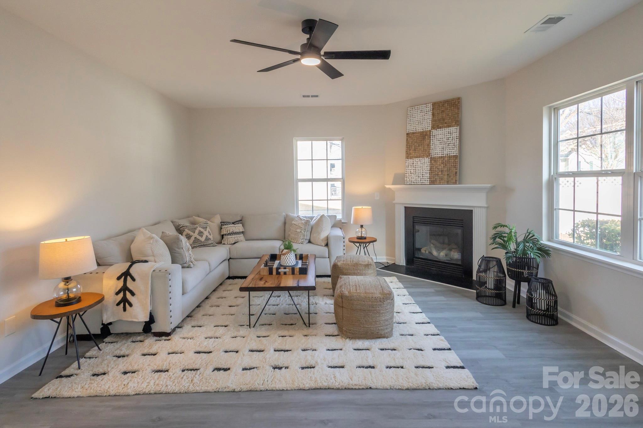 10631 Atkins Ridge Drive Charlotte, NC 28213 - Photo 11 of 38 a living room with furniture and a fireplace