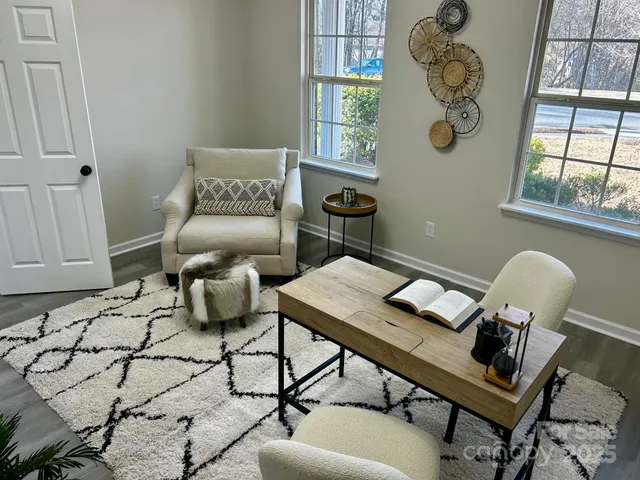 a living room with furniture and window
