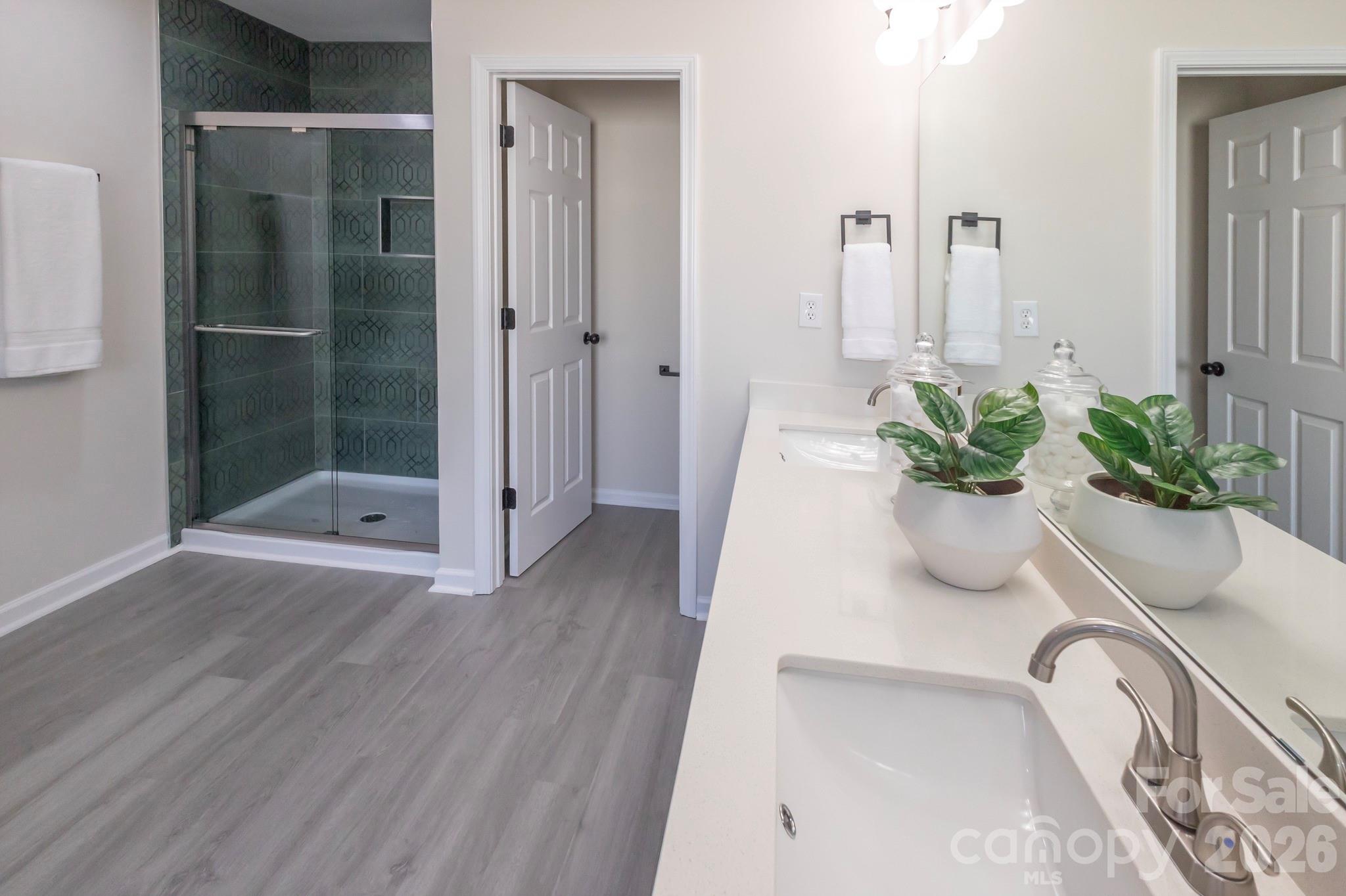 10631 Atkins Ridge Drive Charlotte, NC 28213 - Photo 22 of 38 a view of a glass door with a potted plant