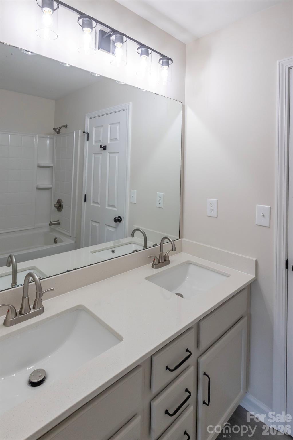 10631 Atkins Ridge Drive Charlotte, NC 28213 - Photo 26 of 38 a bathroom with a sink and a mirror