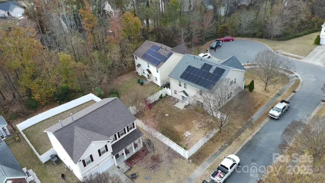 an aerial view of a house with a swimming pool