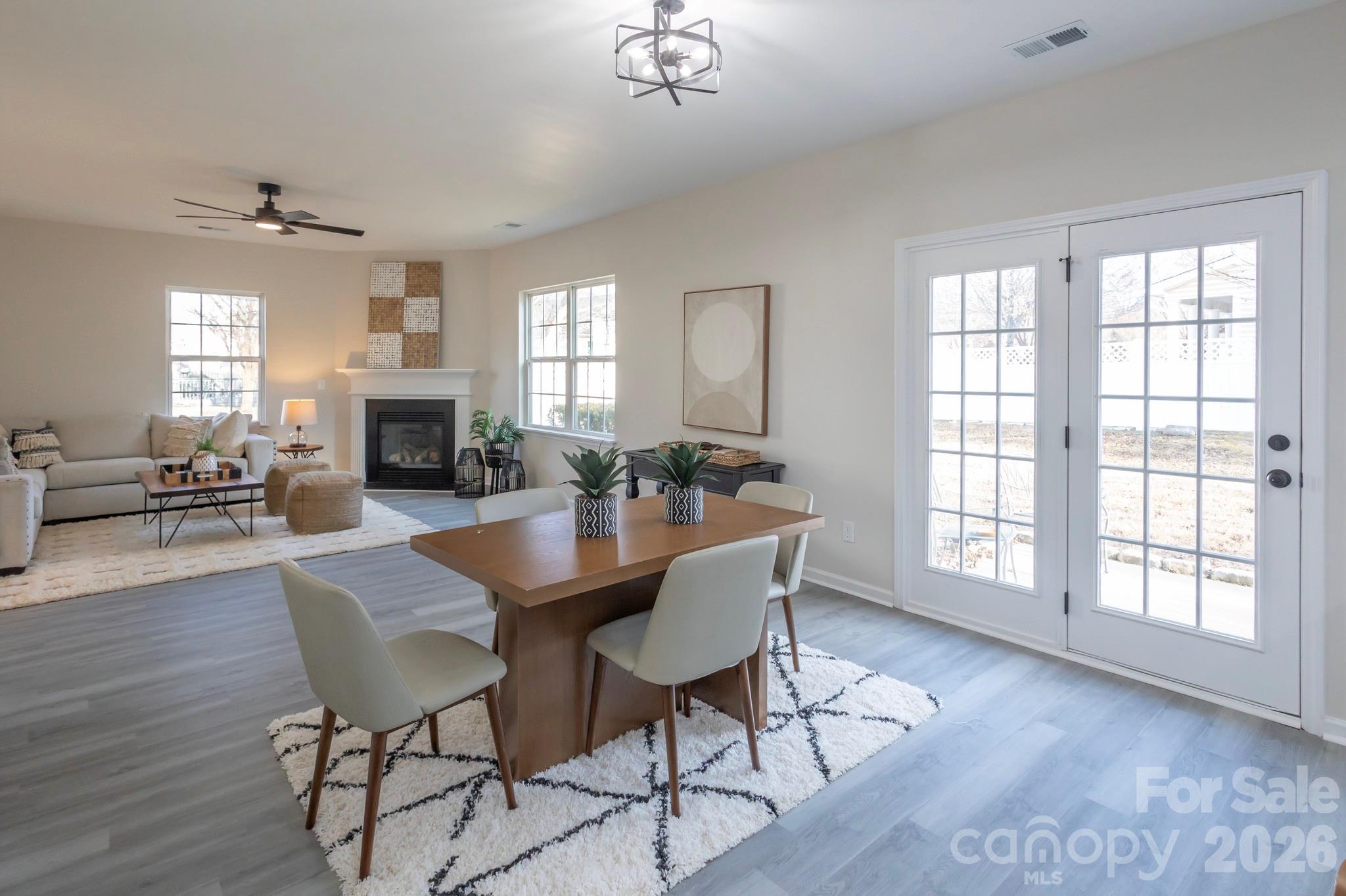 10631 Atkins Ridge Drive Charlotte, NC 28213 - Photo 8 of 38 a view of a dining room with furniture window and wooden floor