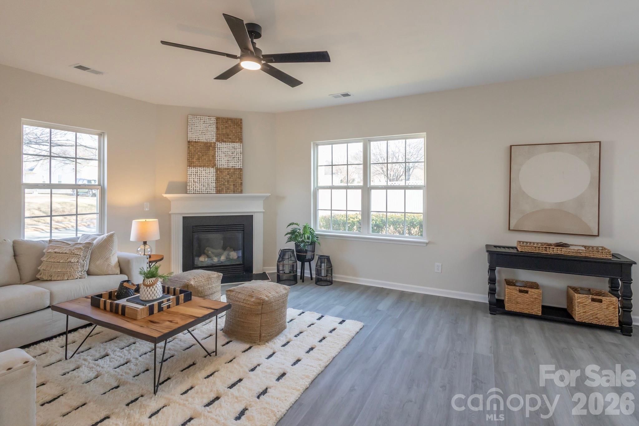 10631 Atkins Ridge Drive Charlotte, NC 28213 - Photo 10 of 38 a living room with furniture and a fireplace