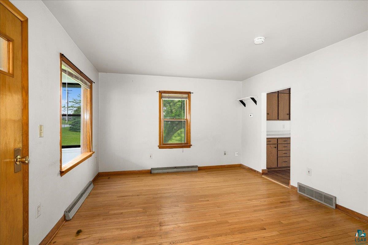 424 East Upham Road Duluth, MN 55811 - Photo 2 of 38 Hardwood flooring throughout featuring natural wood trim, large windows