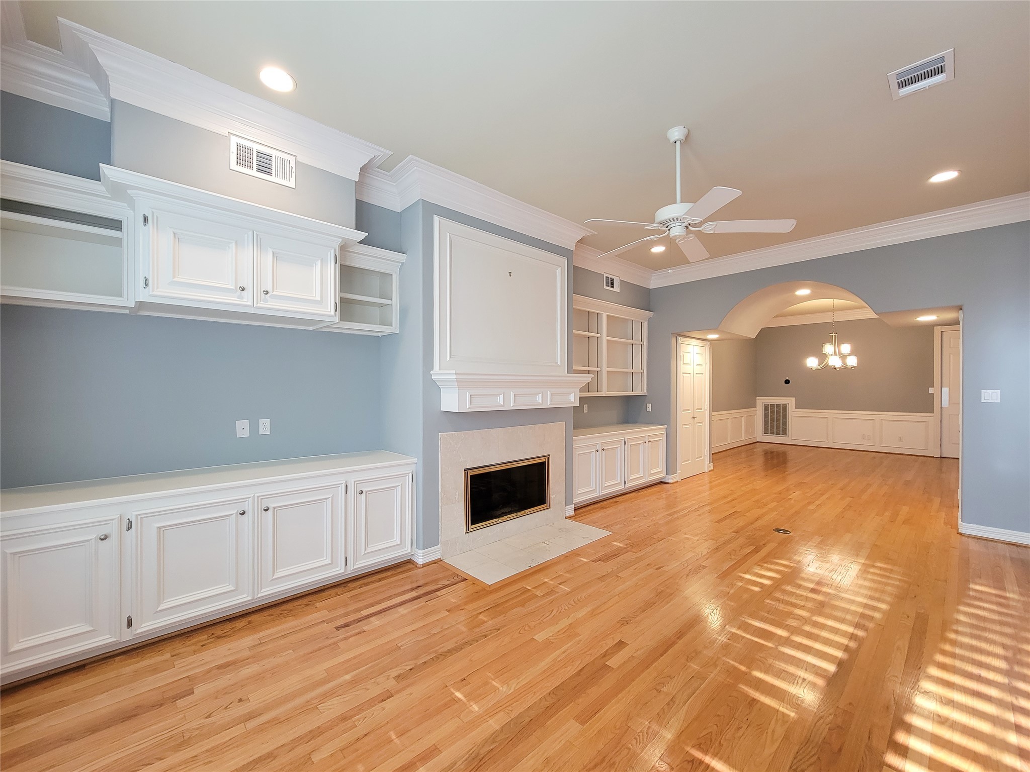 6304 Pickens Street, Unit B Houston, TX 77007 - Photo 3 of 15 a view of an empty room with kitchen fireplace and wooden floor