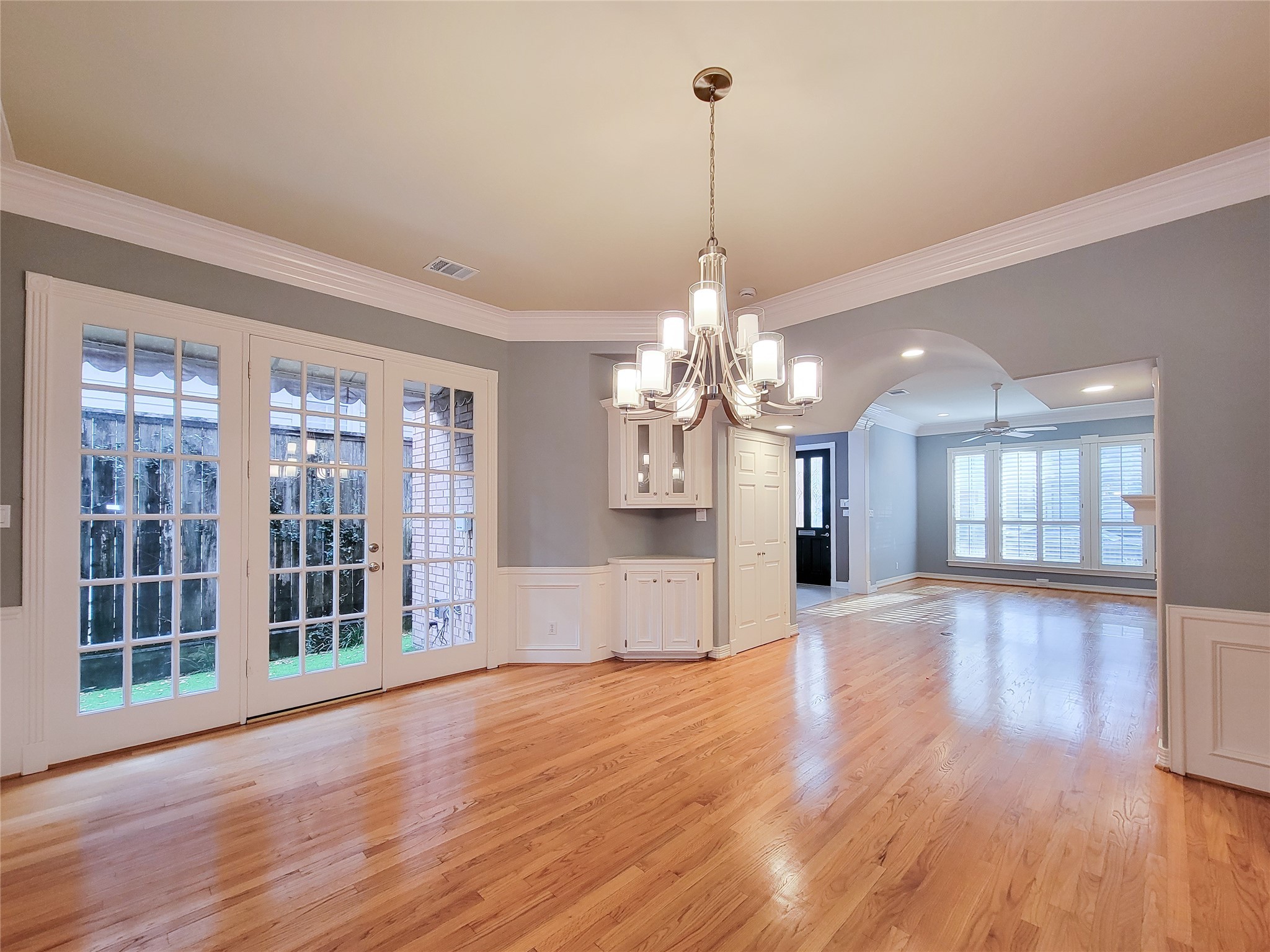 6304 Pickens Street, Unit B Houston, TX 77007 - Photo 4 of 15 a view of a big room with wooden floor chandelier and windows