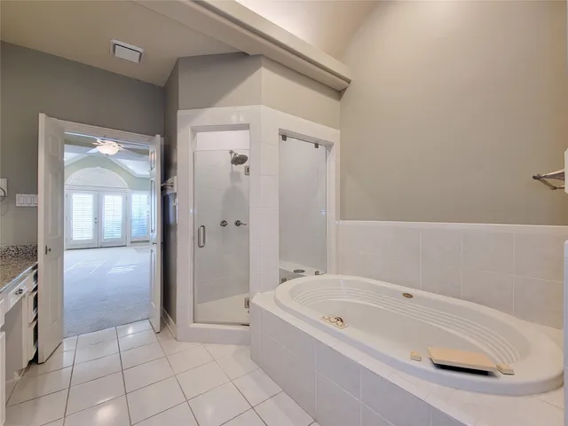 a bathroom with a bathtub and shower