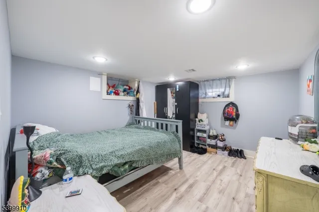 a bedroom with a bed and a storage