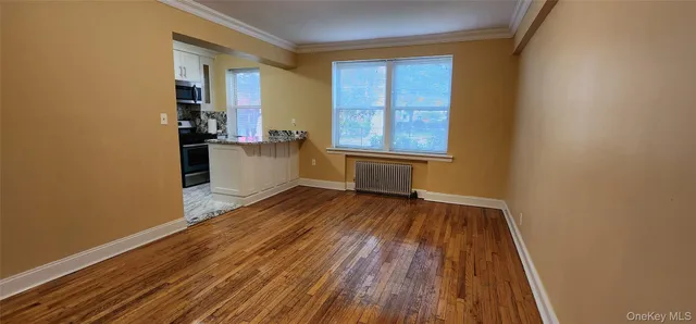 wooden floor in an empty room and a window