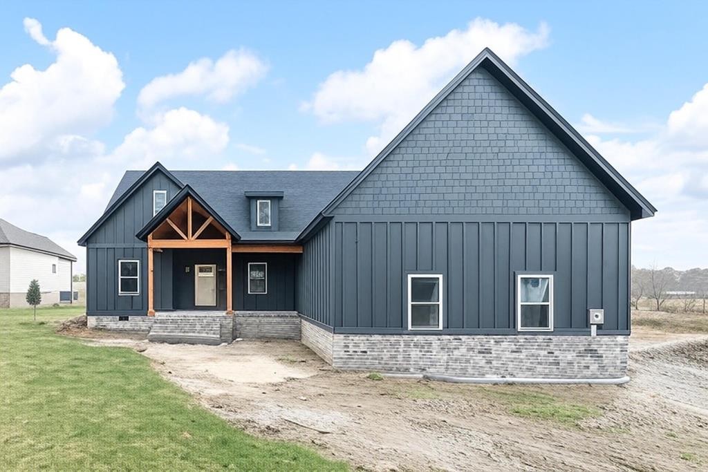 6584 Thomas Twin Oaks Road Baxter, TN 38544 - Photo 1 of 23 a front view of a house with garden