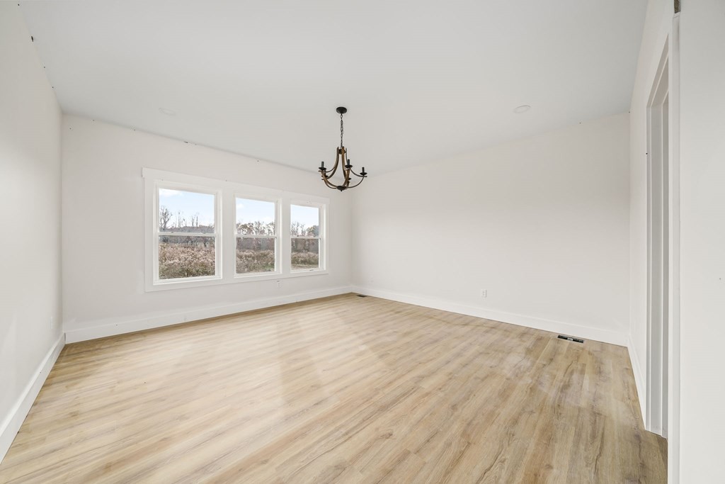 6584 Thomas Twin Oaks Road Baxter, TN 38544 - Photo 14 of 23 a view of an empty room with wooden floor and a window