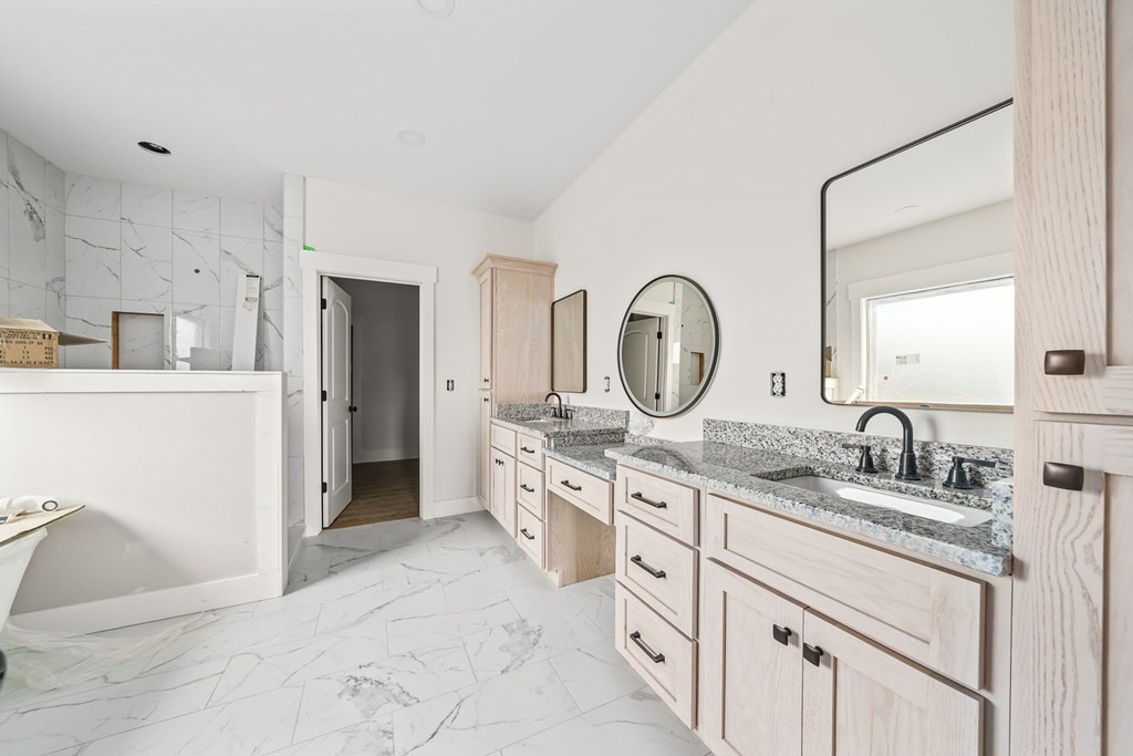 6584 Thomas Twin Oaks Road Baxter, TN 38544 - Photo 16 of 23 a spacious bathroom with a granite countertop sink mirror and a shower