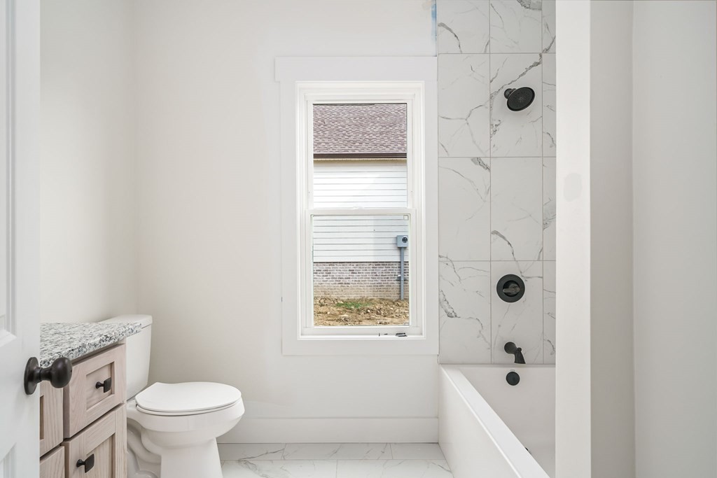 6584 Thomas Twin Oaks Road Baxter, TN 38544 - Photo 20 of 23 a bathroom with a toilet and a shower