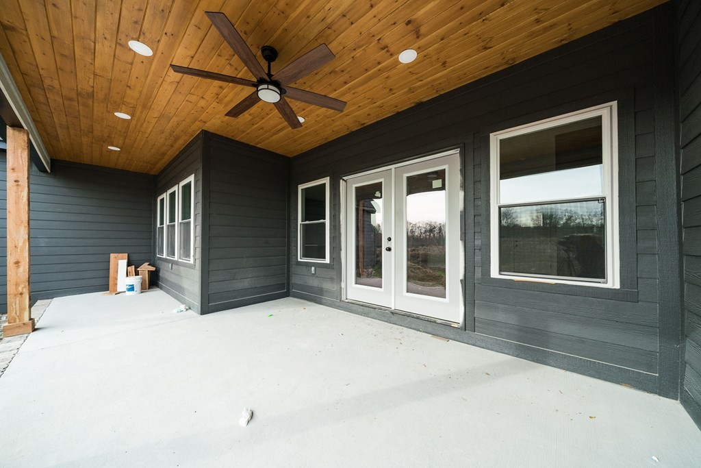 6584 Thomas Twin Oaks Road Baxter, TN 38544 - Photo 23 of 23 a view of a house with a ceiling fan and a large window