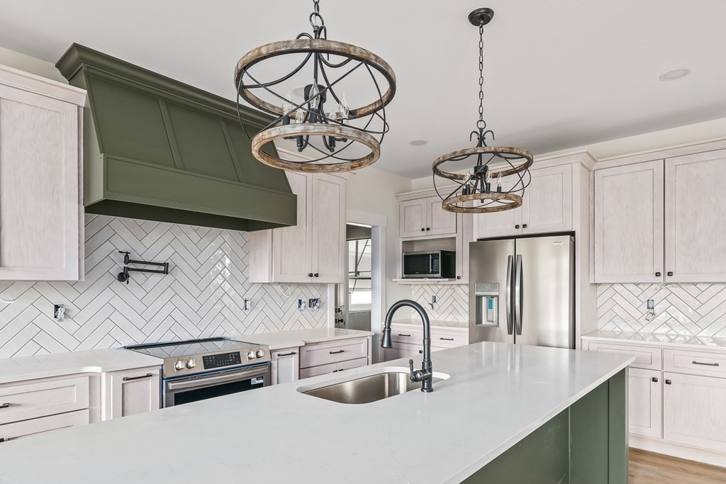 6584 Thomas Twin Oaks Road Baxter, TN 38544 - Photo 8 of 23 a kitchen with stainless steel appliances granite countertop a sink a stove and refrigerator