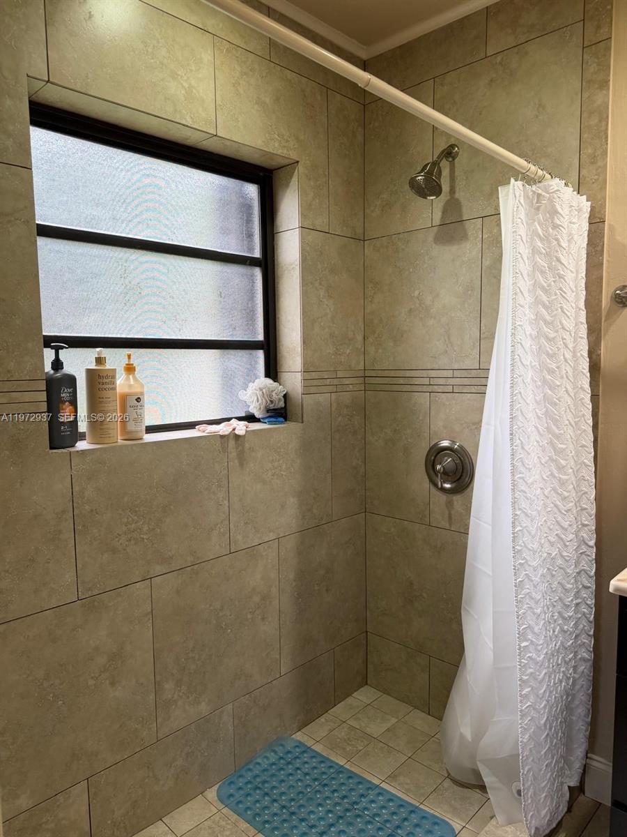 1350 Northwest 96th Street, Unit 2 Miami, FL 33147 - Photo 9 of 12 a bathroom with a shower
