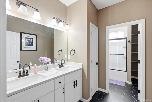 a bathroom with a double vanity sink mirror and double