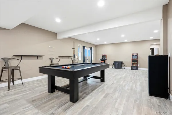 a living room with furniture a table and a flat screen tv