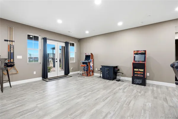 a view of a room with furniture and wooden floor