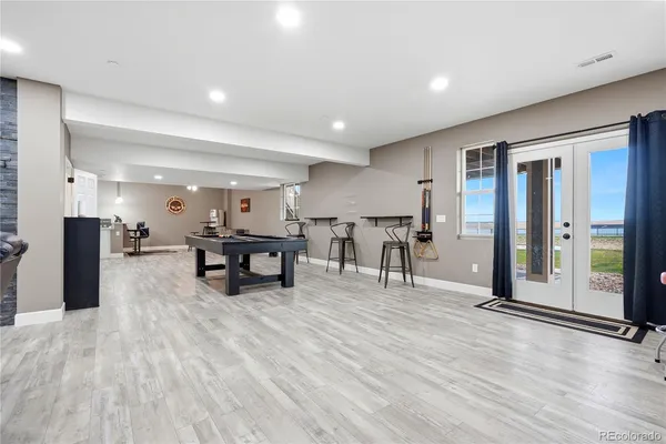 a room with lots of furniture and view of living room
