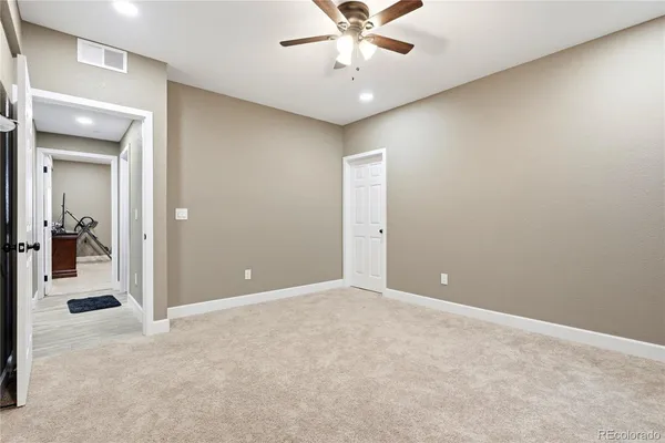 a view of a livingroom with a chandelier fan