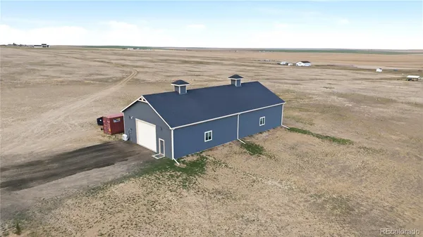 an aerial view of a house with a ocean view