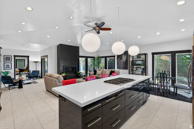 145 Carnesecca Court Mapleton, UT 84664 - Photo 108 of 109 Kitchen featuring modern cabinets, a kitchen island, open floor plan, ceiling fan, and vaulted ceiling