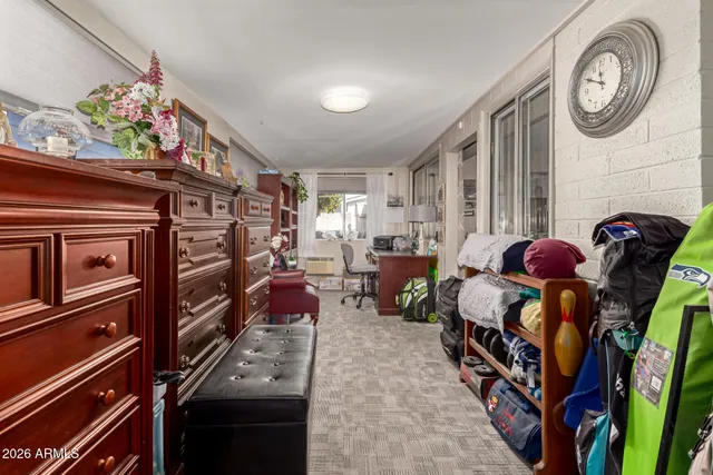 a bathroom with a granite countertop sink mirror vanity and toilet