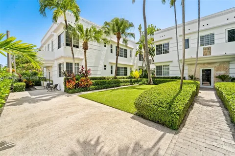 a view of a building with a garden