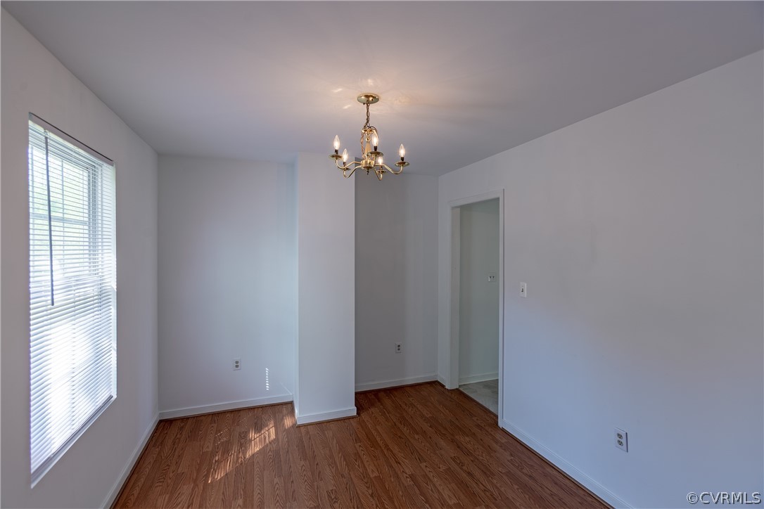 4025 Frye Terrace Colonial Heights, VA 23834 - Photo 12 of 30 a view of an empty room with wooden floor and a window