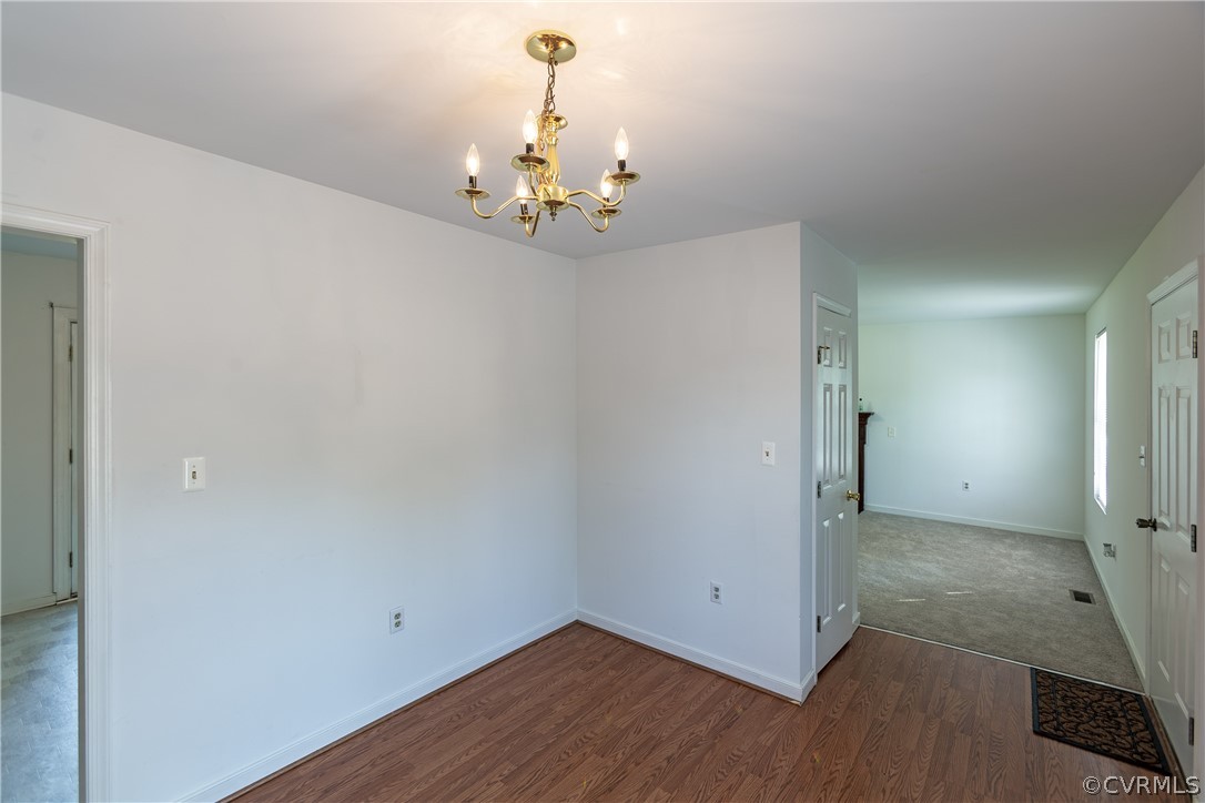 4025 Frye Terrace Colonial Heights, VA 23834 - Photo 13 of 30 a view of a room with wooden floor and chandelier