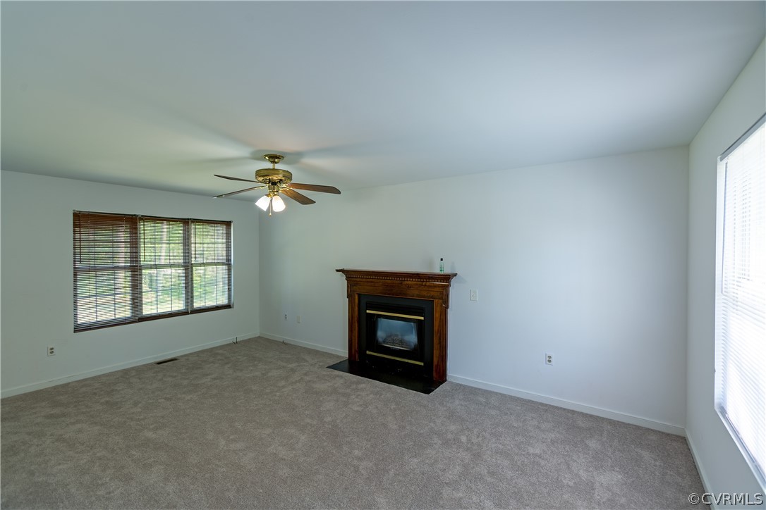 4025 Frye Terrace Colonial Heights, VA 23834 - Photo 14 of 30 an empty room with chandelier fan and windows
