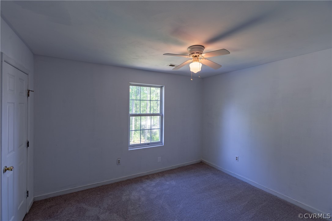 4025 Frye Terrace Colonial Heights, VA 23834 - Photo 21 of 30 an empty room with a window and a ceiling fan