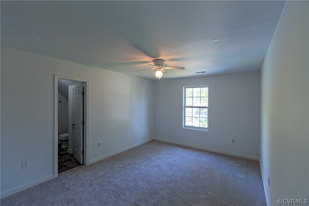 4025 Frye Terrace Colonial Heights, VA 23834 - Photo 23 of 30 an empty room with a window and a chandelier fan