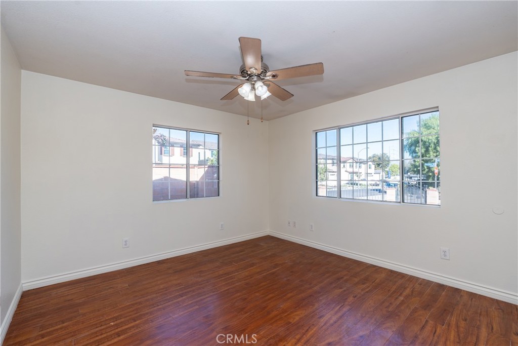 16302 Rochlen Street Hacienda Heights, CA 91745 - Photo 4 of 17 a view of an empty room with wooden floor and a window